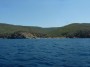 Gita in barca a Baratti, Piombino (LI) - La spiaggia di Cala San Quirico con lo sfondo del verde promontorio coperto di macchia mediterranea - Fotografia 8 luglio 2012, Toscana
