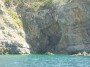 Gita in barca a Baratti, Piombino (LI) - A Cala Buia la costa rocciosa � scavata in una accenno di grotta sovrastato da particolari stalattiti - Fotografia 8 luglio 2012, Toscana