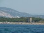 Gita in barca a Baratti, Piombino (LI) - La Torre Vecchia fa da sfondo alla spiaggia che da Poggio del Molino e il porto dello Stellino prosegue per chilometri fino a San Vincenzo. Sullo sfondo si vedono le colline di Campiglia Marittima. La Torre Vecchia sorge in localit Torraccia dal medioevo. Fonti storiche fissano la data di costruzione fra il XII e il XIII secolo ad opera dei Pisani - Fotografia 8 luglio 2012, Toscana