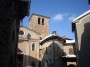 Montieri (GR) - Piazzetta della Chiesa. Sulla sinistra il prospetto della pieve dei Santi Paolo e Michele, al centro antiche abitazioni costruite sulla cinta muraria del paese, sulla destra l