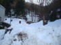 Montieri (GR) - Inizio della strada sotto glia alberi al limite del paese che porta alla chiesa di San Giacomo Apostolo. Lungo la strada coperta dalla neve  presente una artistica Via Crucis - Fotografia Marzo 2010