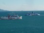 Navi e traghetti in Toscana - Motonavi Toremar Oglasa e Moby Love si incrociano sulla rotta Piombino Portoferraio in una assolata giornata invernale - Fotografia gennaio 2014