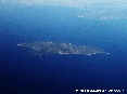 Isola del Giglio (Gr) - Foto aerea della superba Isola del Giglio. La foto è stata scattatada una quota di circa 32000 piedi ovvero circa 10000 metri di altitudine dal livello del mare. (Luglio 2006)