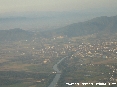 Pisa (Pi) - Foto aerea della citt. In primo piano il fiume Arno fra e sullo sfondo il monte Serra. Si nota bene il ponte sull