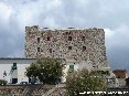 Piombino (LI) - Prospetto del lato mare del castello di Piombino immortalato da viale del Popolo con le spalle al canale di Piombino e all